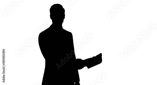 Silhouette of person holding object