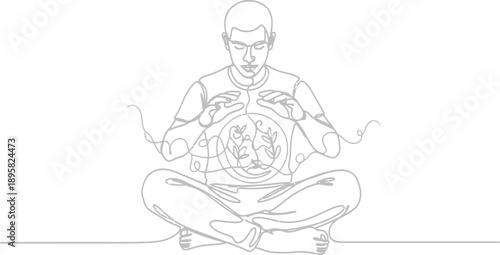 Man meditating with globe in hand