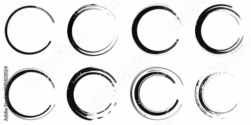 Arrangement of black circular brush strokes on a plain white background