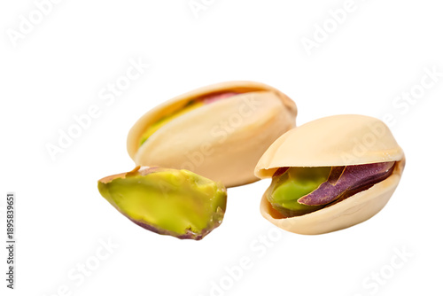 Two roasted and salted pistachios, one in its shell and one open, isolated as a transparent PNG.