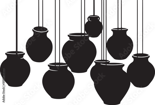 Black clay vases hanging from strings in a row