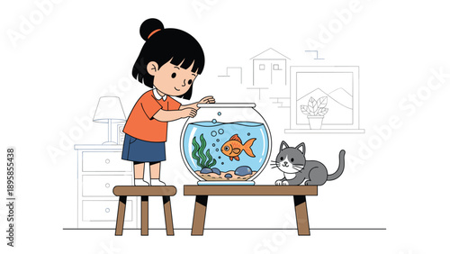 Small girl stands on a stool to feed a goldfish in a glass bowl while a curious grey cat watches from the table beside her.