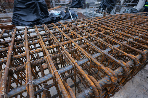 Valokuva Shallow depth of field (selective focus) details with reinforcing bars (rebar) on a construction site