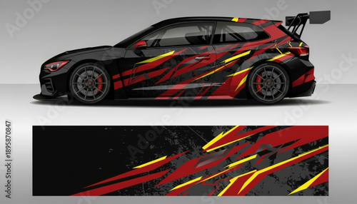 Side view of a black racing car featuring a vibrant red and yellow abstract graphic vinyl decal design.