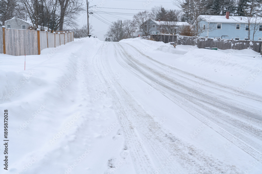 Obraz premium residential street after winter snow
