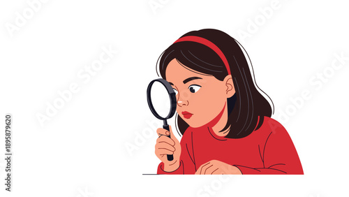 Curious young girl looking closely through a magnifying glass to explore and discover new things during her learning.