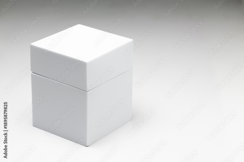 Obraz premium Small white box on a large white box against a white background