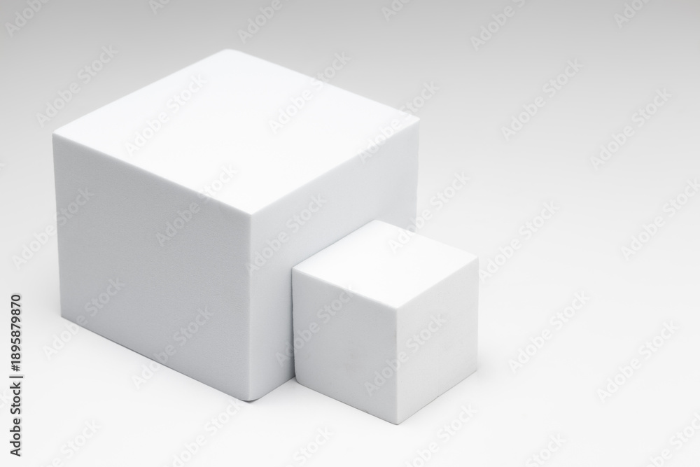 Fototapeta premium Small and large white boxes placed sideways on a white background