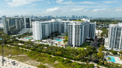 A panoramic aerial view features 1 Hotel Miami Beach framed by the Atlantic Ocean and Miami’s resort skyline.