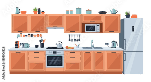 Wide view of modern kitchen interior featuring wooden cabinets with various appliances and accessories including stove and silver refrigerator.