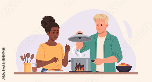 Couple discovers their meal has burned, looking distressed and worried