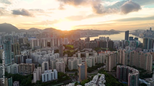 Wallpaper Mural Morning sunrise drone shot of Hong Kong, showcasing tall buildings and calm harbor waters. Torontodigital.ca