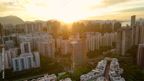 Wallpaper Mural Sunrise aerial drone shot of Hong Kong skyline, with long shadows and warm tones. Torontodigital.ca
