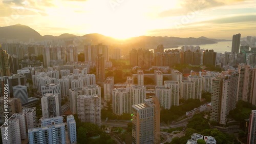 Wallpaper Mural Aerial drone shot of Hong Kong in early morning light, with the city glowing softly. Torontodigital.ca