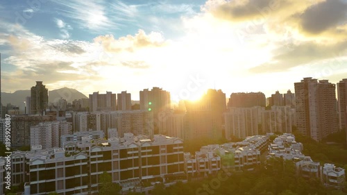 Wallpaper Mural Aerial drone view of Hong Kong during sunrise, with clouds drifting above the city. Torontodigital.ca