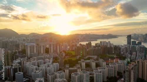 Wallpaper Mural Drone shot of Hong Kong city at dawn, with peaceful streets and glowing skyline. Torontodigital.ca