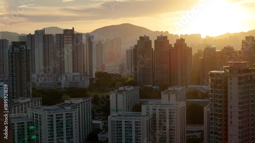 Wallpaper Mural Early morning sunrise aerial view of Hong Kong city, bathed in warm light. Torontodigital.ca