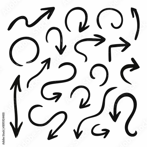 Collection of various black hand-drawn arrows pointing in different directions on a plain surface from a straightforward viewpoint