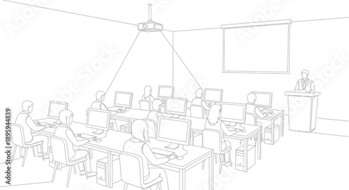 Classroom full of students diligently working on desktop computers during a training session led by an instructor at a podium