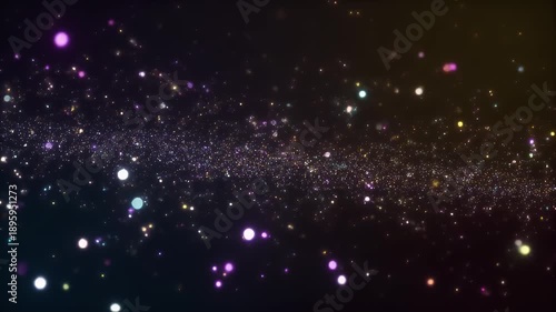 A dark scene showcasing a galaxy of multicolored dots. Larger, blurred circles of light scattered across the composition. It appears to be night sky or some abstract effect