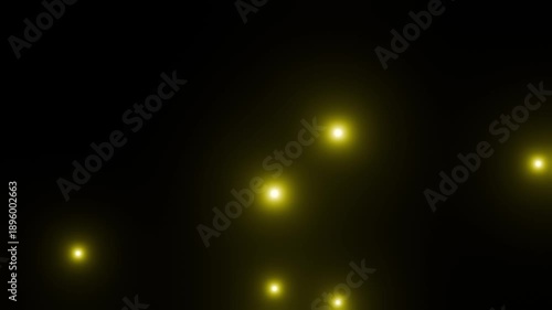 黒背景にゆっくり浮かび上がる黄色の粒子