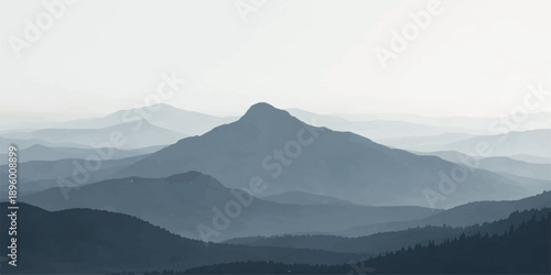 A serene morning landscape of misty blue peaks and forest valleys under a soft sunrise sky with clouds and haze at dawn