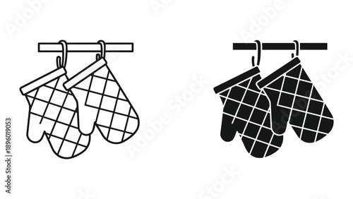 Pair of oven mitts hanging on a hook