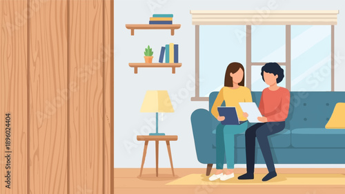 Two people discuss documents on a couch with a lamp and shelves nearby