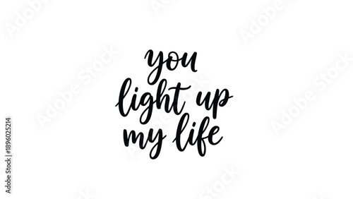 Motivational quote You light up my life written in elegant black cursive calligraphy on a plain white background.