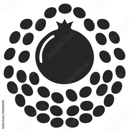 Simple black pomegranate fruit with abstract seeds forming an organic circular pattern