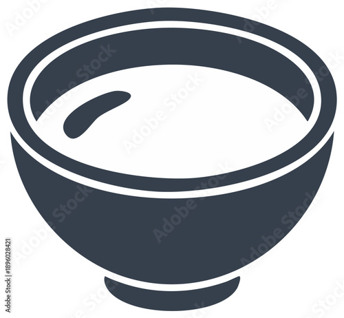 Bowl of creamy white soup or sauce stands ready for savory delight