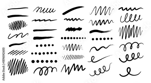 Assorted hand drawn ink strokes and decorative markings