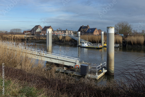 Winter view of the ferry across the Scheldt river at Schellebelle village in Wichelen, East Flanders, Belgium.