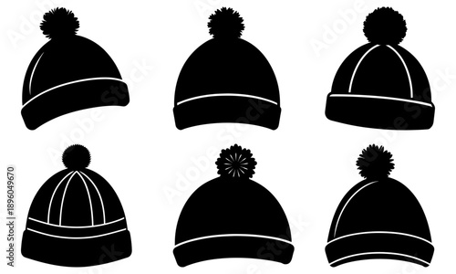 Collection of black beanies with pom-poms and white stripes on a neutral background viewed from the front