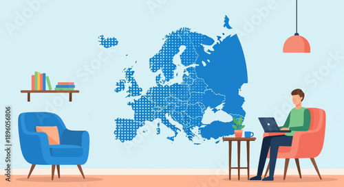Man on laptop at home with map of Europe on wall