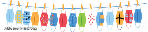 Colorful face masks hanging on a blue string with clothespins in various patterns and colors