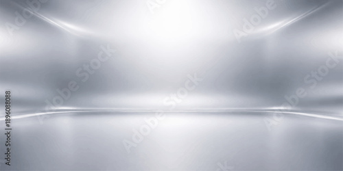 Polished silver metallic background featuring a brushed aluminum texture with shiny stainless steel reflections and an abstract light pattern on a textured gray surface wallpaper design