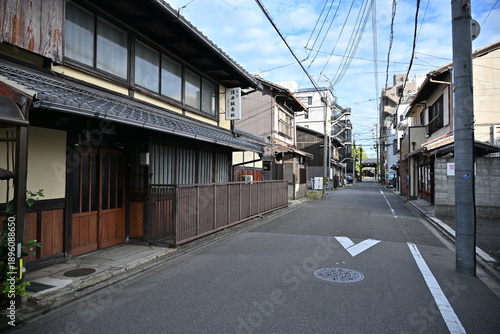 The narrow street view of the residential area in the old part of Kyoto central city along with the old traditional Japanese architecture in Kyoto Japan