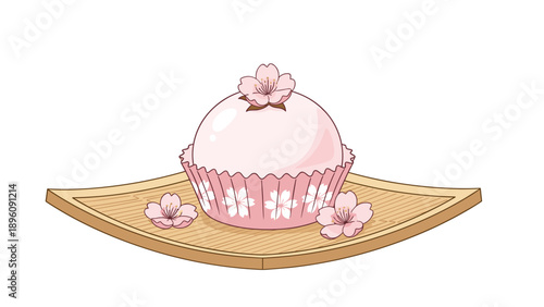 Traditional Japanese mochi dessert served in a pink cupcake liner decorated with delicate cherry blossoms on wood.