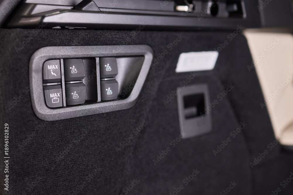 Naklejka premium Vehicle dashboard with functional switches and lights. Detailed image of vehicle dashboard controls highlighting tactile switches and trim for inspection purposes