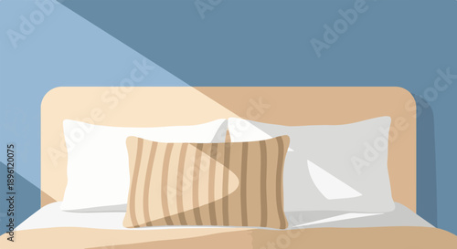 Cozy bed with pillows and sunlight streaming onto a warm, inviting duvet