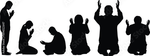 Diverse group of people worshipping with hands raised in a dark silhouette