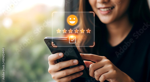 Woman giving a five star rating on a smartphone mobile phone