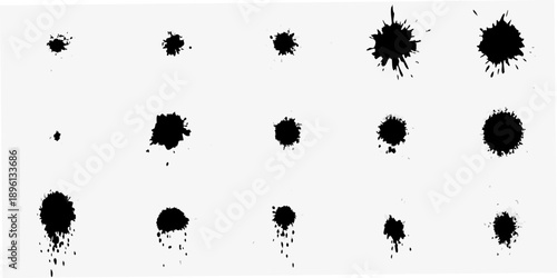 Abstract arrangement of black ink blots on a white background