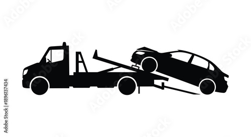 Tow truck transporting a damaged car on a highway black silhouette