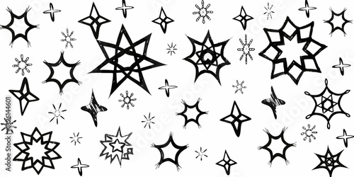 A scattering of hand drawn stars and sparkles on a white background