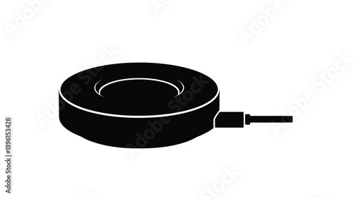 Black wireless charging pad with usb cable on white background for smartphone technology