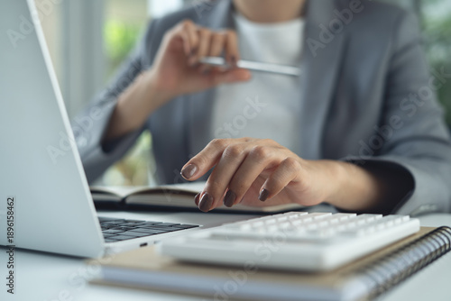 Businesswoman concentrate working on  laptop computer in office, searching the ideas, business solution at office, business planning, close up