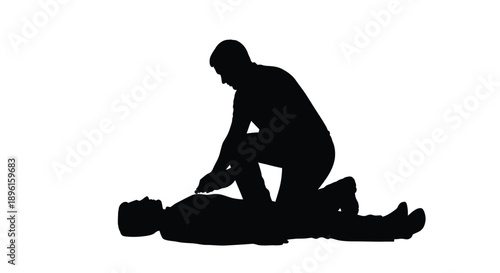 Silhouette of a person kneeling beside another lying down