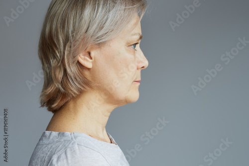 Portrait of a mature woman with a calm confident expression.